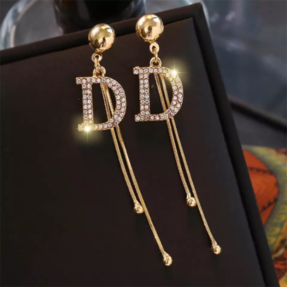 Gold Tone Crystals D Earrings